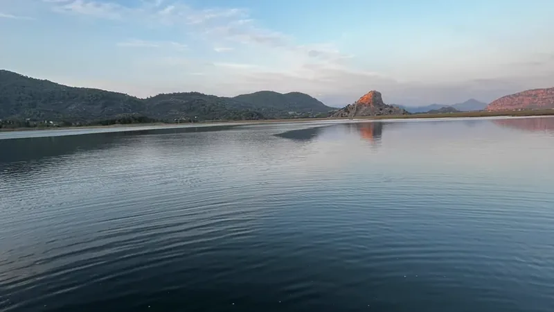 A rocky hill above the delta at twilight