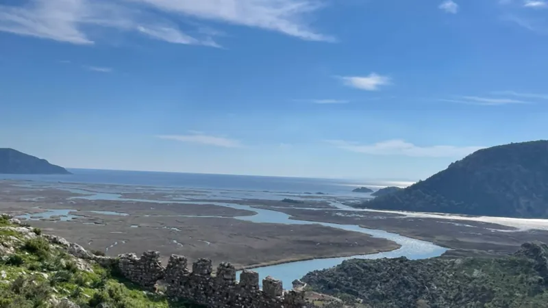 A stretch of the ancient city wall with the delta and the sea behind A stretch of the ancient city wall with the delta and the sea behind