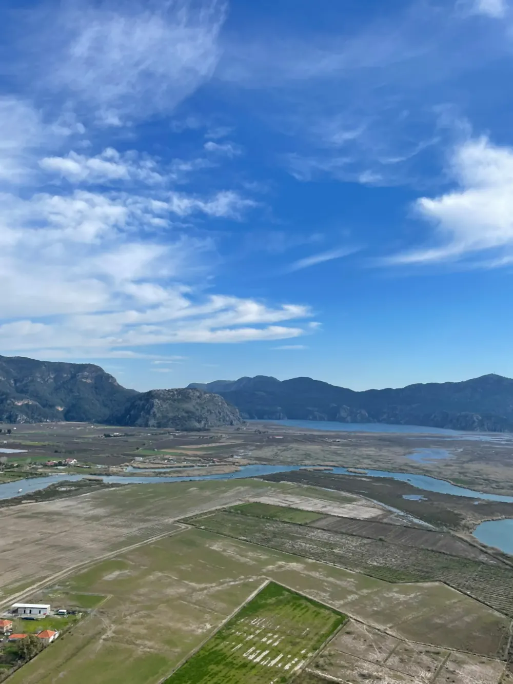 The delta plain and its channels from the hill, fields and water mixed The delta plain and its channels from the hill, fields and water mixed